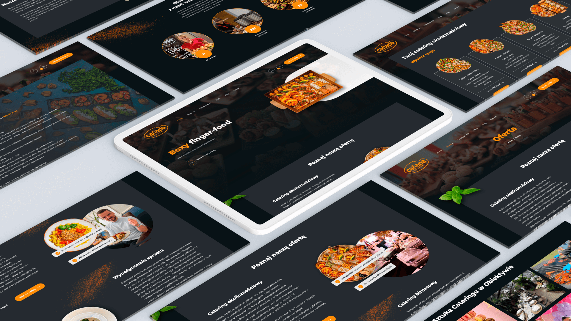 Tablet i ekrany pokazujące stronę internetową firmy cateringowej z ofertą i zdjęciami potraw.