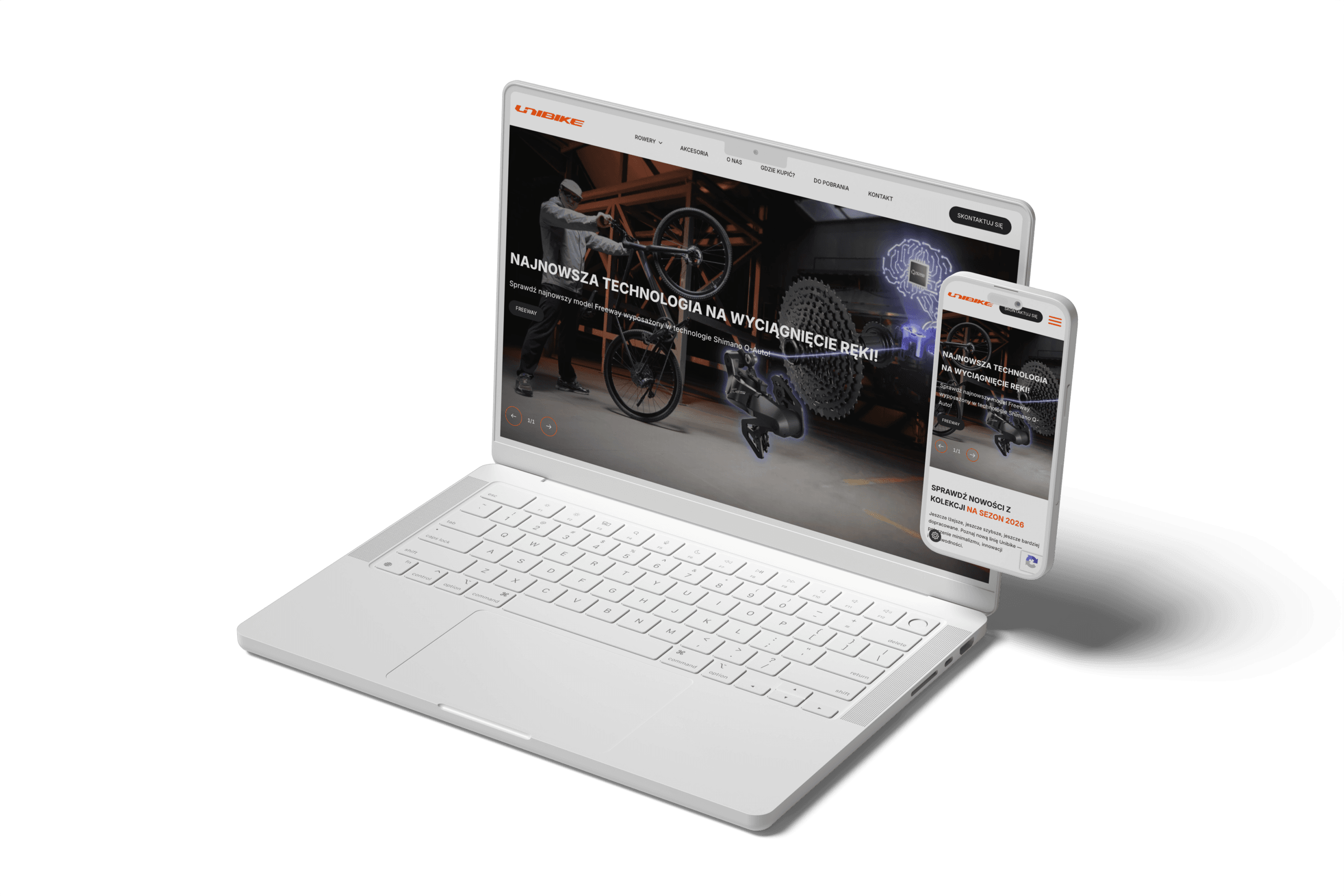 Biały laptop i smartfon z otwartą stroną rowerową na ekranach.